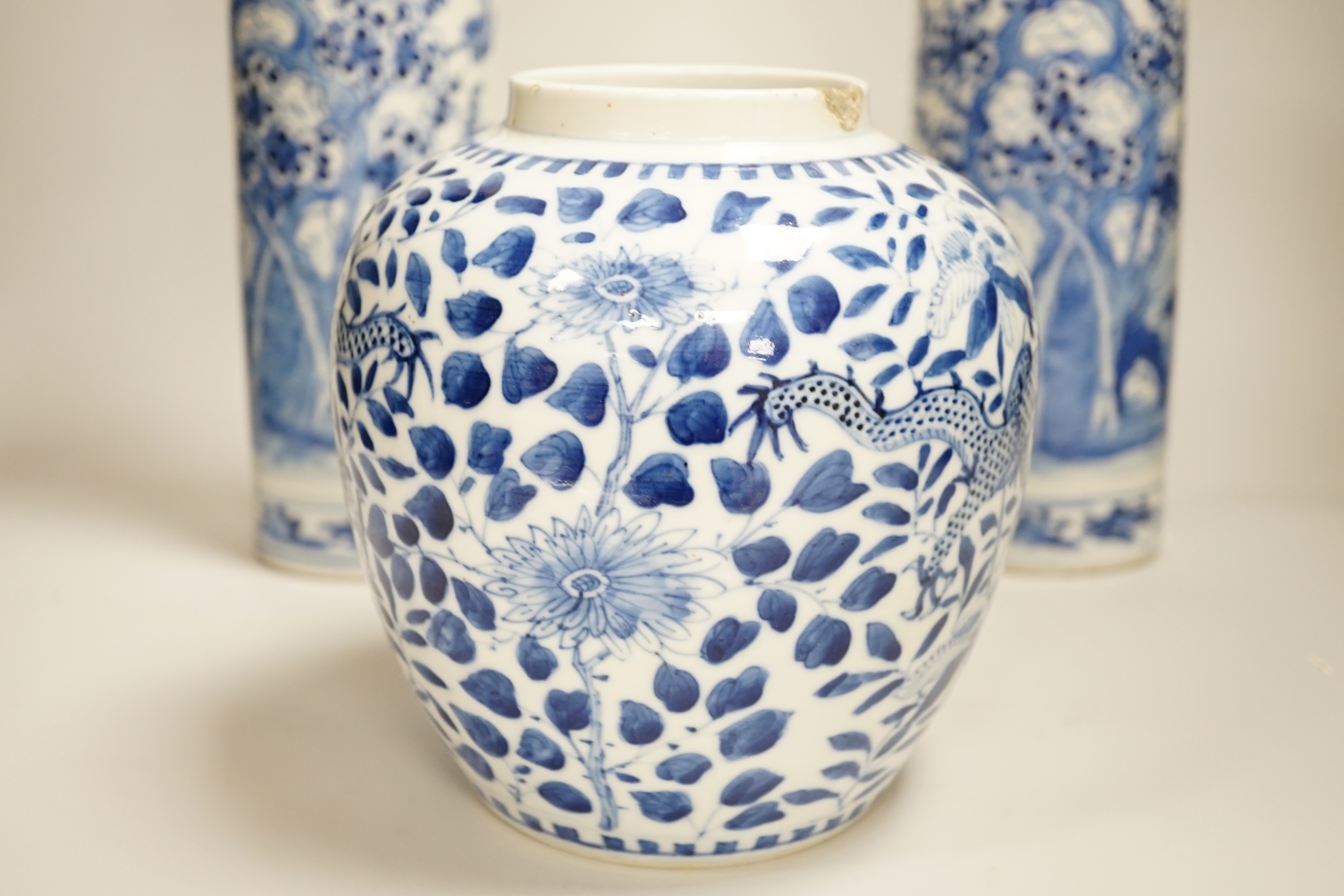A pair of 19th century Chinese blue and white sleeve vases, and a similar ovoid ‘dragon’ jar, vases 31cm high